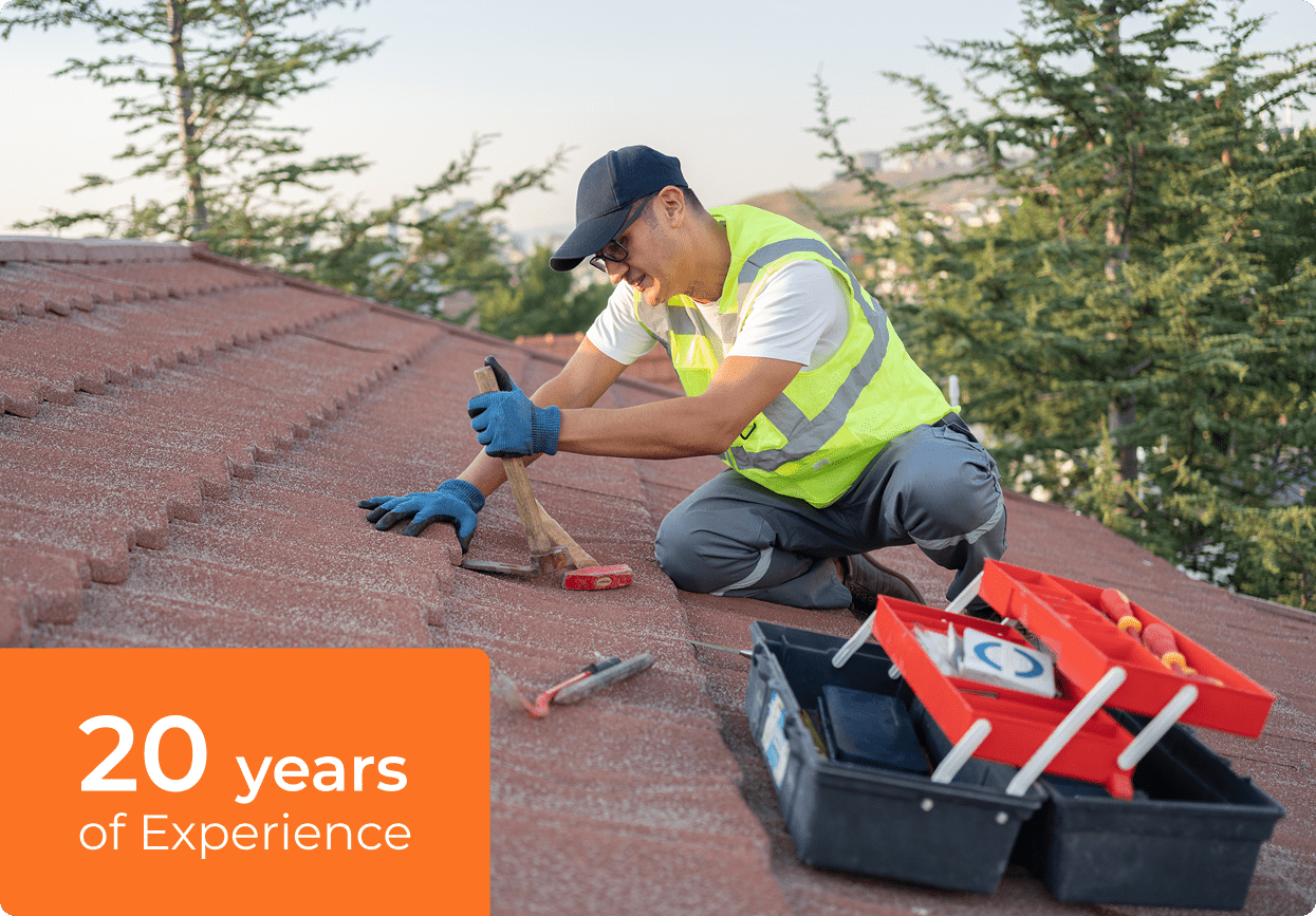 Man in safety gear fixing roof