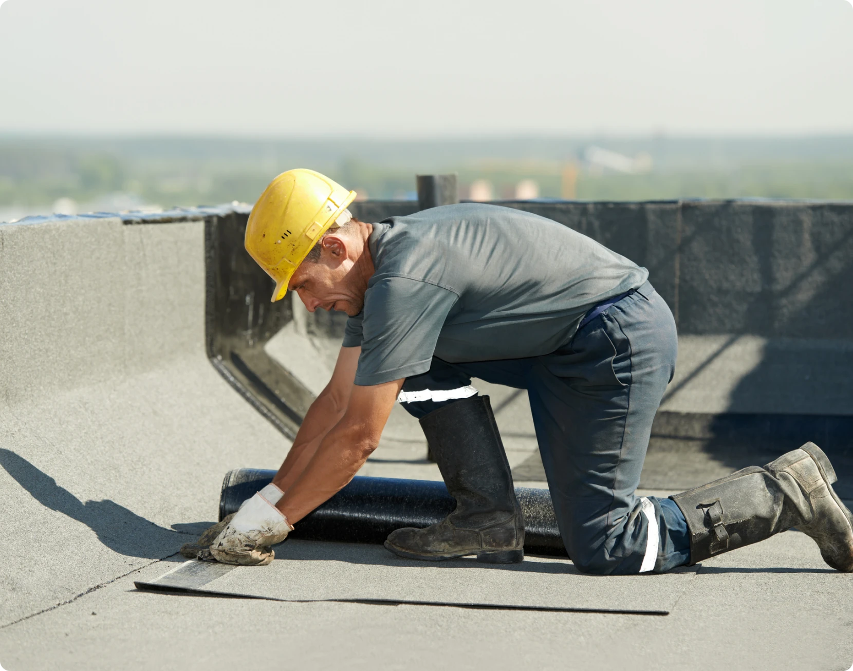 Worker installing roofing materials